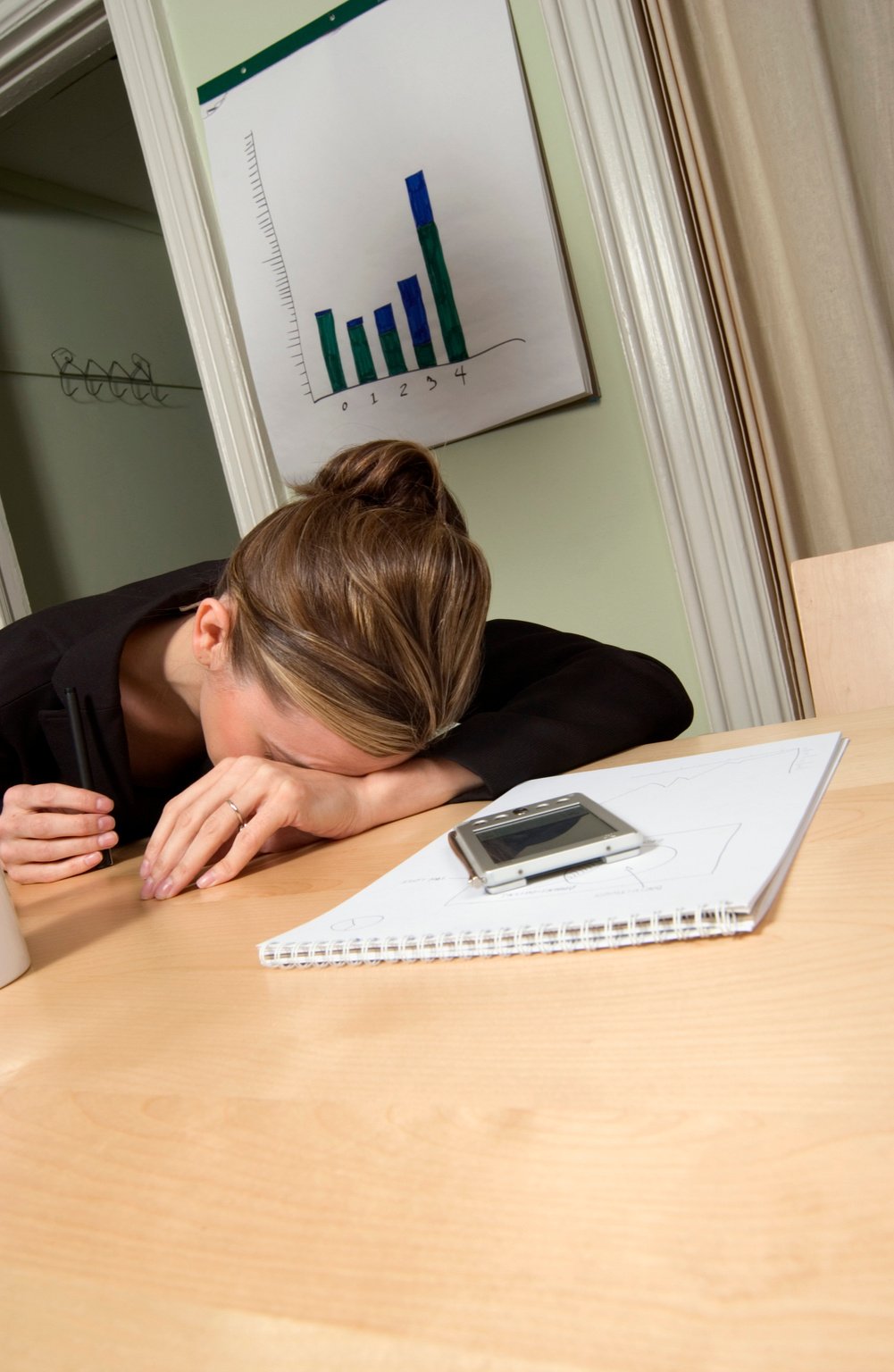 Stressed businesswoman with head down